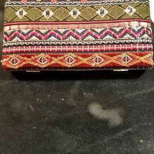 A clutch purse 7 1/2"x7 1/2" red,green,gold,& silver